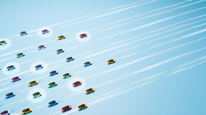 A flock of colorful miniature cars travels in different directions along illuminated, stylized lanes against a light blue gradient background.
